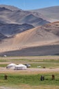 Mongolian nomad camp. Horses and car near traditional mongolian yurt
