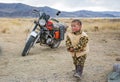 Mongolian nomad child in Mongolian tundra