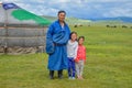 Mongolian Nomad With His Family Near His Ger