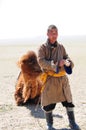 Mongolian nomadic herdsman with his camel