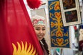 A mongolian woman selling silks and handcrafts from Mongolia. She was working as volunteer in the 4th edition of the United Nation