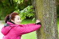 Mongolian woman training with a tree