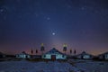 The Mongolian yurts in night starry sky in winter