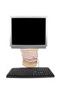 Monitor on the books with the keyboard, collage Royalty Free Stock Photo