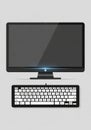 The monitor, a compact keyboard is visible, featuring white keys with Royalty Free Stock Photo