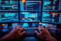 Software developer writing code on laptop in dark office at night Royalty Free Stock Photo