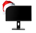 Monitor and Santa Claus hat Royalty Free Stock Photo