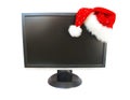 Monitor and Santa Claus hat Royalty Free Stock Photo