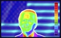 Vector graphic of Thermographic image of a man face showing different temperatures on blurred background.