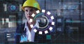 Monitoring engineer reviewing digital overlays in industrial plant, with clipboard and hard hat Royalty Free Stock Photo