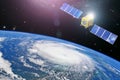 Monitoring hurricane. Satellite above the Earth makes measurements of the weather parameters and movement trajectory. Elements of Royalty Free Stock Photo