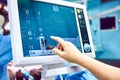 Monitoring patient`s vital sign in operating room. doctor cheking at patient`s vital signs. Cardiogram monitor during Royalty Free Stock Photo