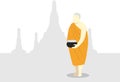 Buddhist Monk with Alms Bowl at Thai Temple Silhouette in background. Concept for religion and buddhism. Royalty Free Stock Photo