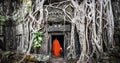 Monk in Angkor Wat Cambodia. Ta Prohm Khmer temple