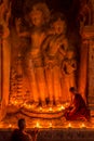 Monk in Bagan old town pray a buddha statue