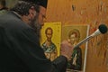 Monk being busy painting an icon in a Greek monastry