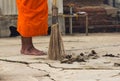 Monk with broom leaf