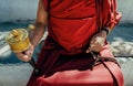 Monk, buddhist, tibetan buddhist, tibetan, buddhist monk, spinning prayer wheel, mala, religion, tibet, holding, person, red, hand Royalty Free Stock Photo