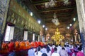 Monk and Buddhist worship Gold Buddha