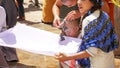 Monk child getting a haircut in public in Kalaw city, Myanmar / Burma.