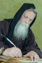 Monk chronicler Royalty Free Stock Photo