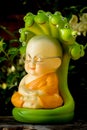 Monk doll meditating to luminosity Royalty Free Stock Photo