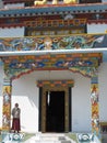 Monk at entrance of a Tibetan monastery Royalty Free Stock Photo