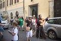 Monk with Guitar and Crowd