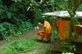 Monk has head shaved at Wat Tam Seu-uh, Krabi, Thailand.