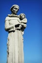 Monk Holding Infant Statue