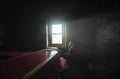 Monk from Lamayuru Monastery who reads the evening prayers in his small room lit by a single window