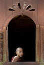 Monk looking out the window, Inle Lake, Myanmar