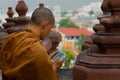 Monk looking at smart-phone