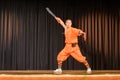 Monk at magical power show with two swords - Shaolin Kung Fu Show