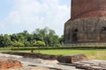 A monk near the Dhamek stupa. Sarnath, India