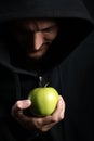 Monk offers an apple Royalty Free Stock Photo