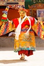 Monk performs a masked and costumed sacred dance of Tibetan Buddhism during the Cham Dance Festival