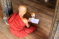 Monk Play With Cat In Shwe Yan Pyay Monastery, Nyaungshwe, Myanmar Royalty Free Stock Photo