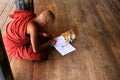 Monk Play With Cat In Shwe Yan Pyay Monastery, Nyaungshwe, Myanmar