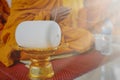 A monk prays with the holy thread in the Buddhists Auspicious ceremony.