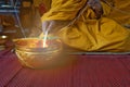 A monk prays with the holy water in the Buddhists Auspicious ceremony.