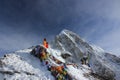 Monk prays in the snowy mountains of Nepal.