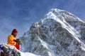 Monk prays in the snowy mountains of Nepal