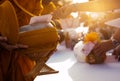 Monk receiving food and items offering