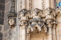 Monk`s face and other details on the facade of Basilica of St.Peter and St. Paul