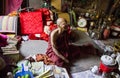 A monk smiling in his shed.