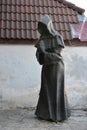 Monk statue in old town of Tallinn, Estonia Royalty Free Stock Photo