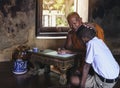 Monk teaching children books in rural temples. Royalty Free Stock Photo
