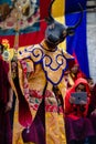 Monk Tibetan Buddhist in traditional demon ghost outfit performing Dance at Tiji Festival in Nepal