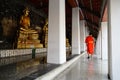 A monk walk in a temple in peaceful moment ,Bangkok,Thailand. Royalty Free Stock Photo